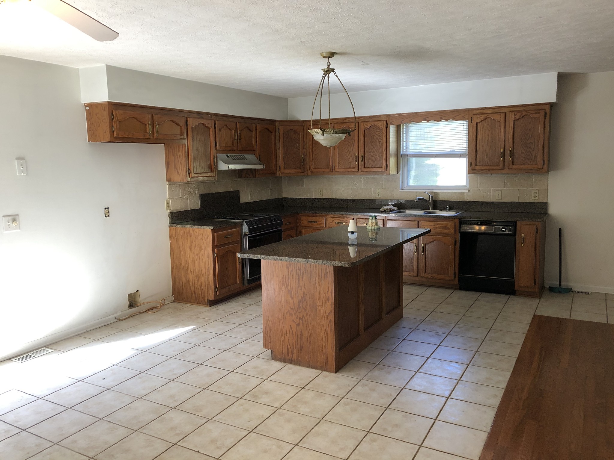 7535 Webster Road Greenbrier, TN 37073 - Photo 8 of 23 a kitchen with stainless steel appliances granite countertop a stove a sink and a refrigerator