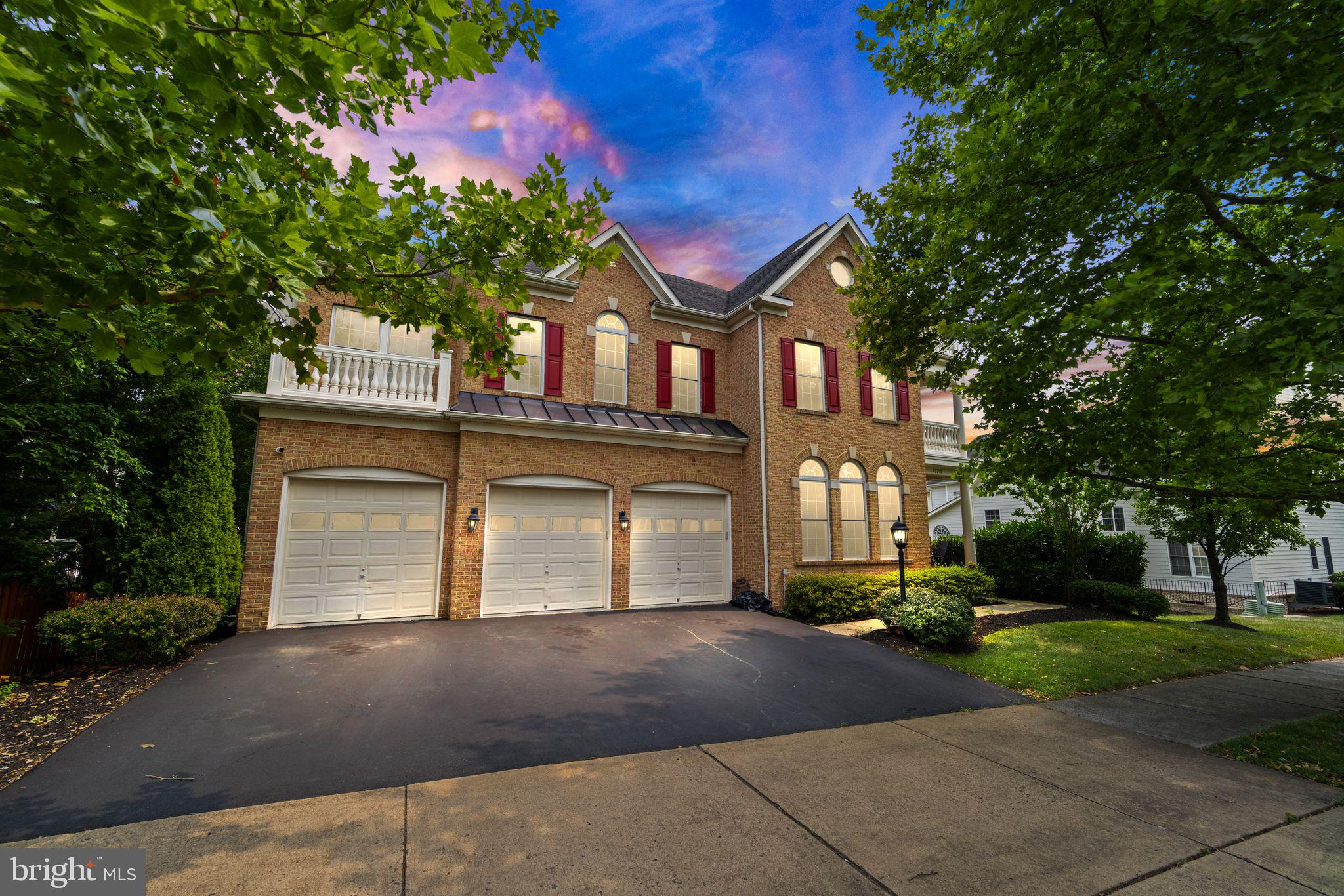43393 Riverpoint Drive Leesburg, VA 20176 - Photo 1 of 87 a front view of a house with a yard and garage