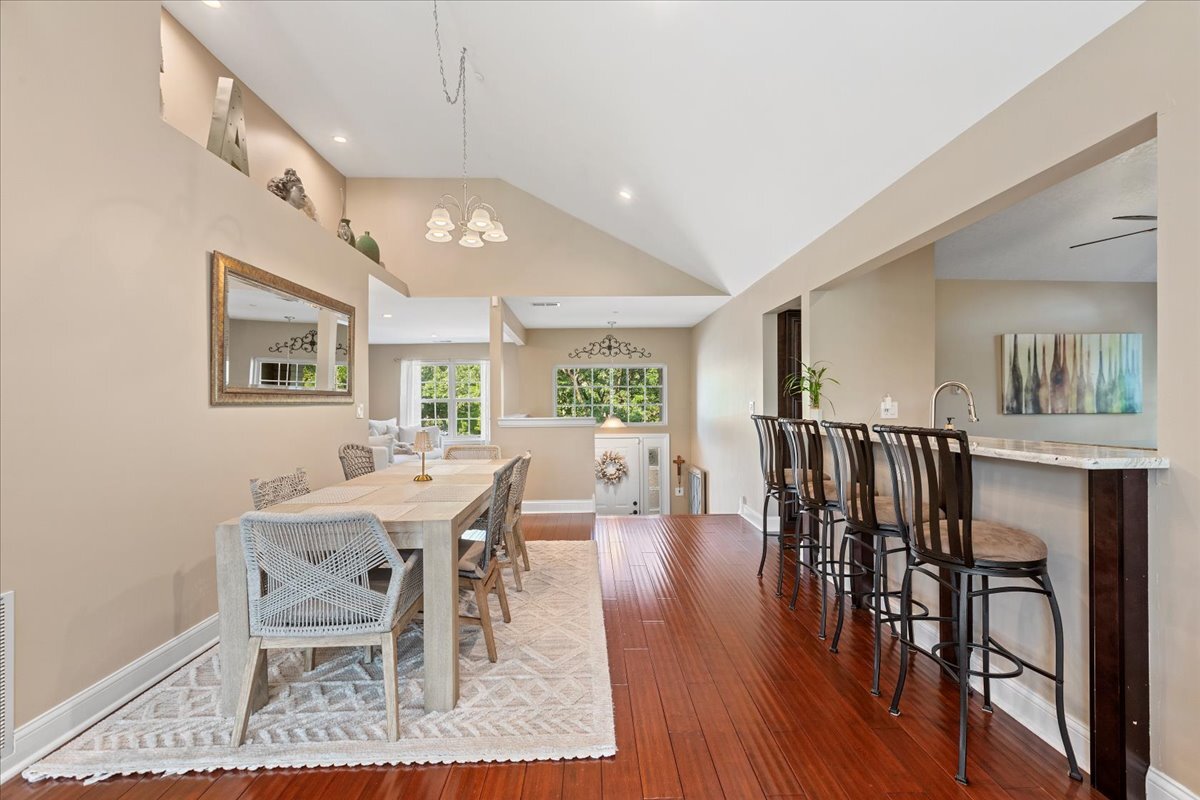 1636 Columbia Circle, Unit 2 Bartlett, IL 60103 - Photo 13 of 47 a view of a dining room with furniture and wooden floor
