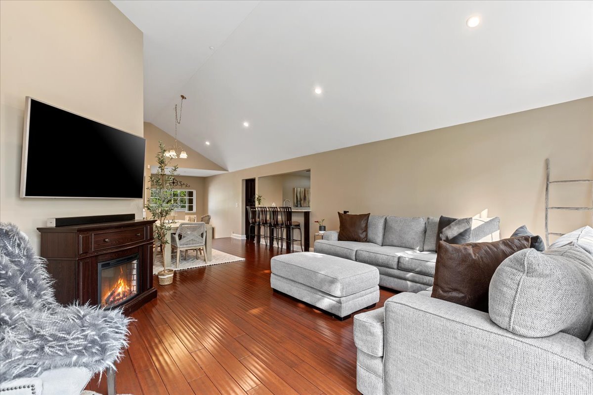 1636 Columbia Circle, Unit 2 Bartlett, IL 60103 - Photo 16 of 47 a living room with fireplace furniture and a flat screen tv