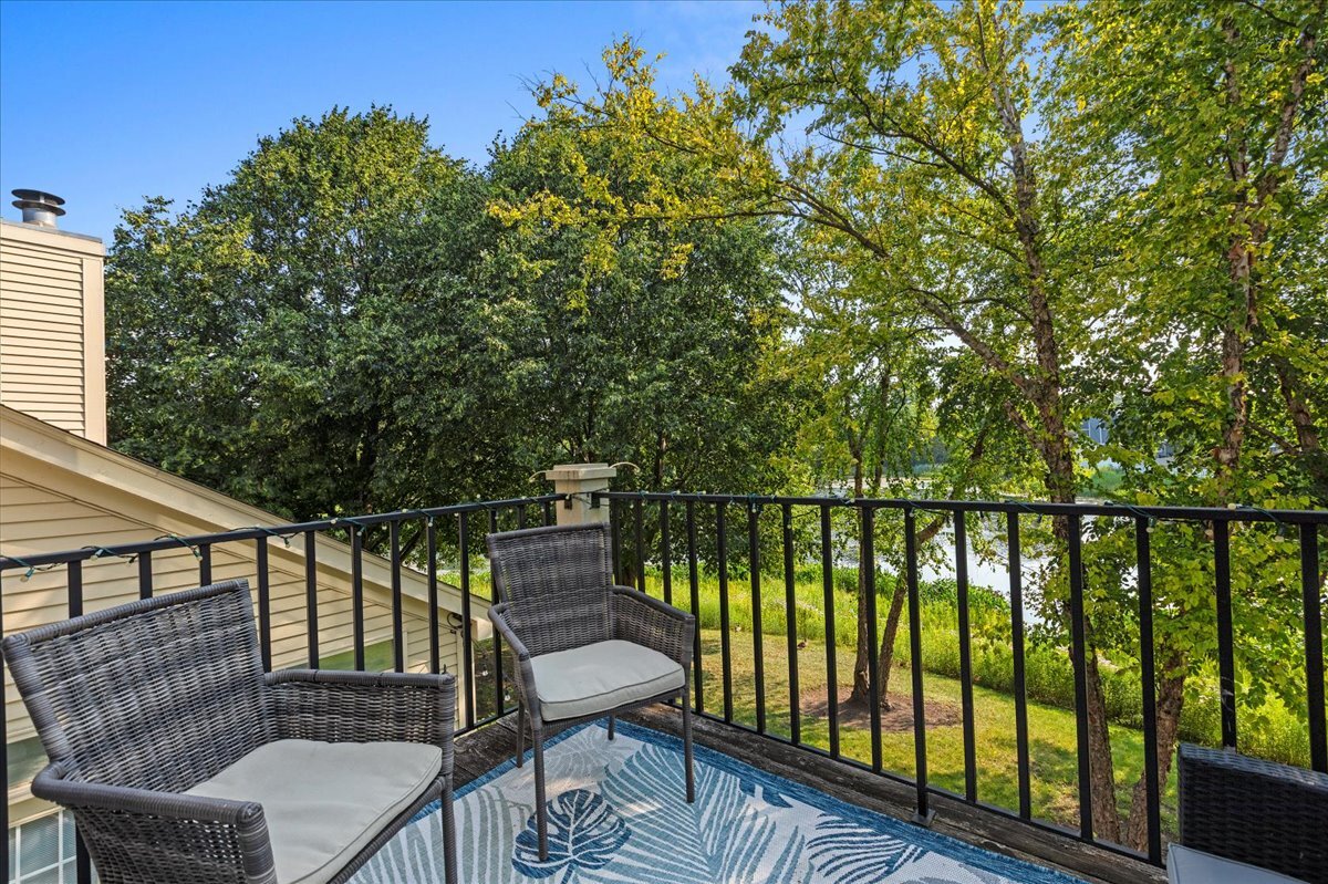 1636 Columbia Circle, Unit 2 Bartlett, IL 60103 - Photo 18 of 47 a balcony with wooden floor and outdoor seating