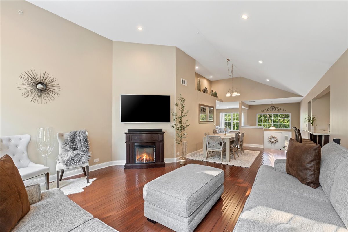 1636 Columbia Circle, Unit 2 Bartlett, IL 60103 - Photo 19 of 47 a living room with fireplace furniture and a flat screen tv