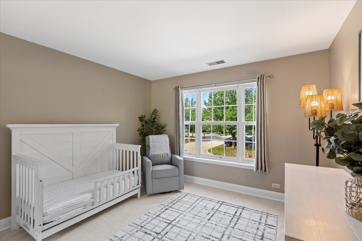 1636 Columbia Circle, Unit 2 Bartlett, IL 60103 - Photo 23 of 47 a living room with furniture and a window