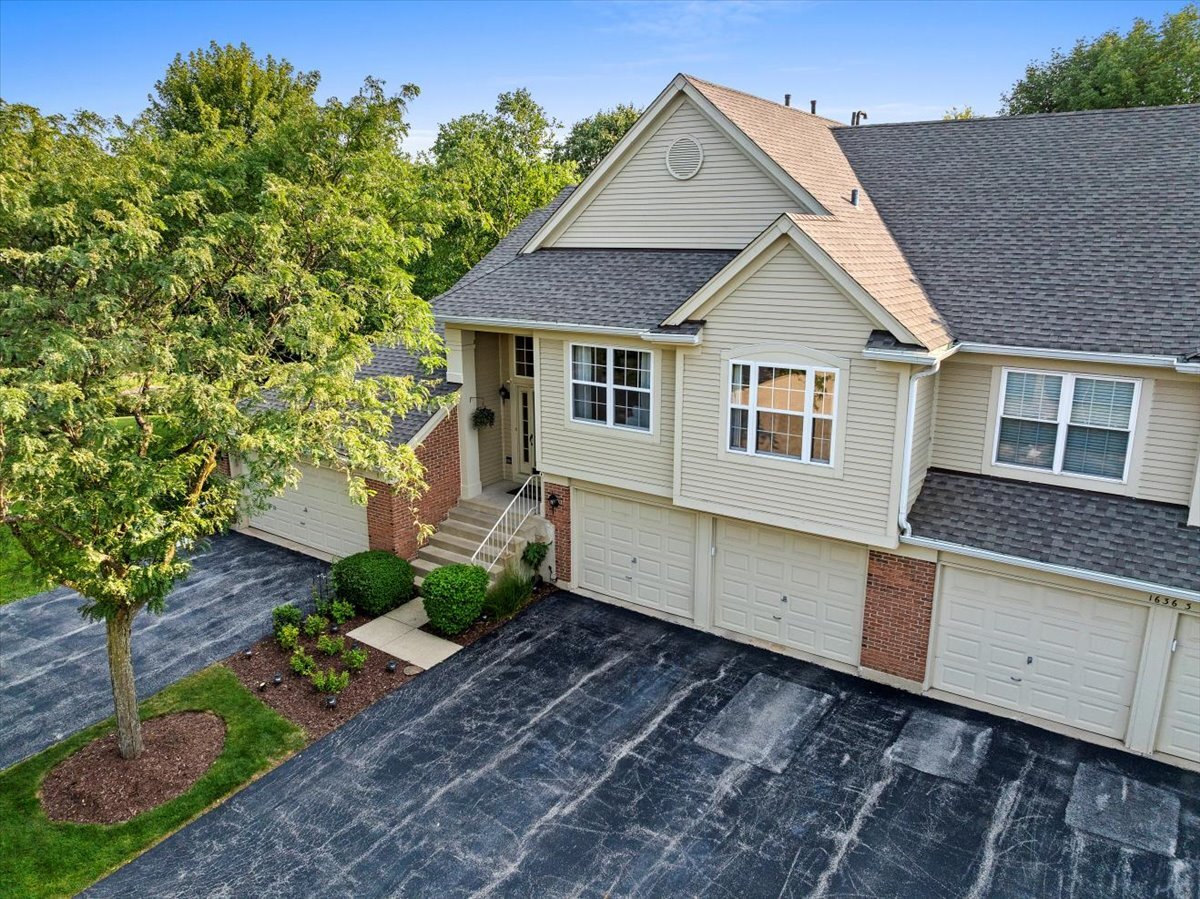 1636 Columbia Circle, Unit 2 Bartlett, IL 60103 - Photo 3 of 47 a view of a house with a yard