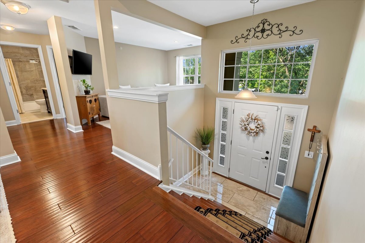 1636 Columbia Circle, Unit 2 Bartlett, IL 60103 - Photo 31 of 47 a view of a kitchen with fridge and wooden floor