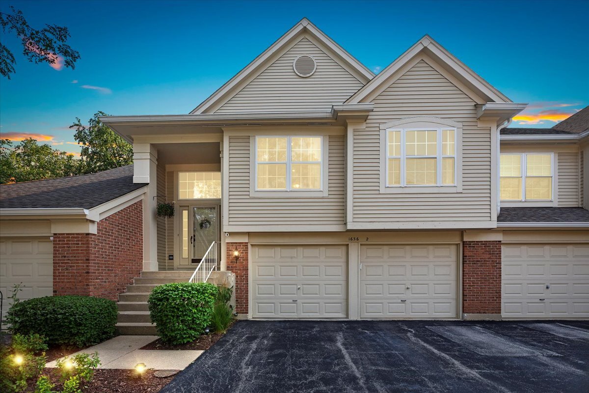 1636 Columbia Circle, Unit 2 Bartlett, IL 60103 - Photo 36 of 47 a front view of a house with a yard