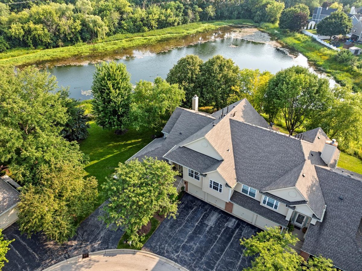 1636 Columbia Circle, Unit 2 Bartlett, IL 60103 - Photo 37 of 47 an aerial view of a house with a yard and lake view