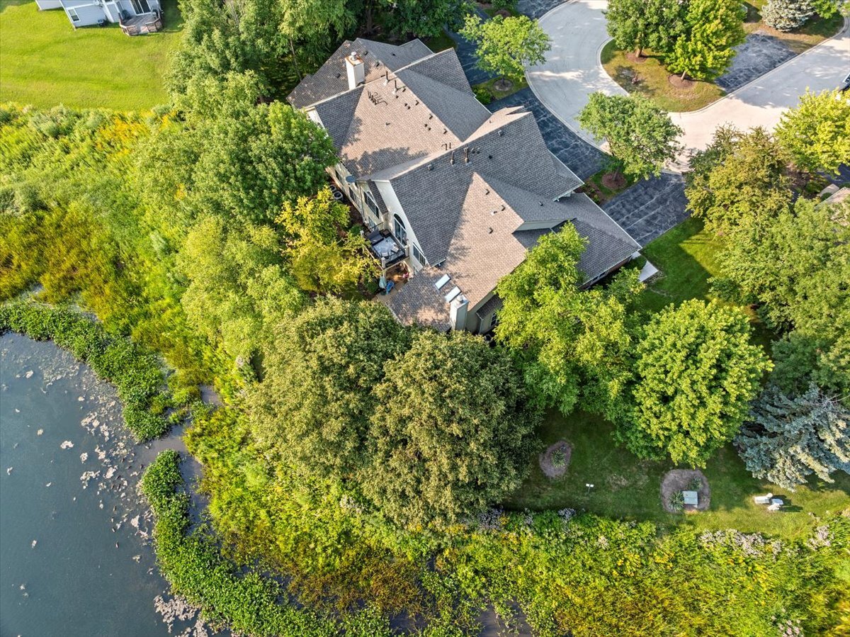 1636 Columbia Circle, Unit 2 Bartlett, IL 60103 - Photo 38 of 47 an aerial view of a house with swimming pool and garden