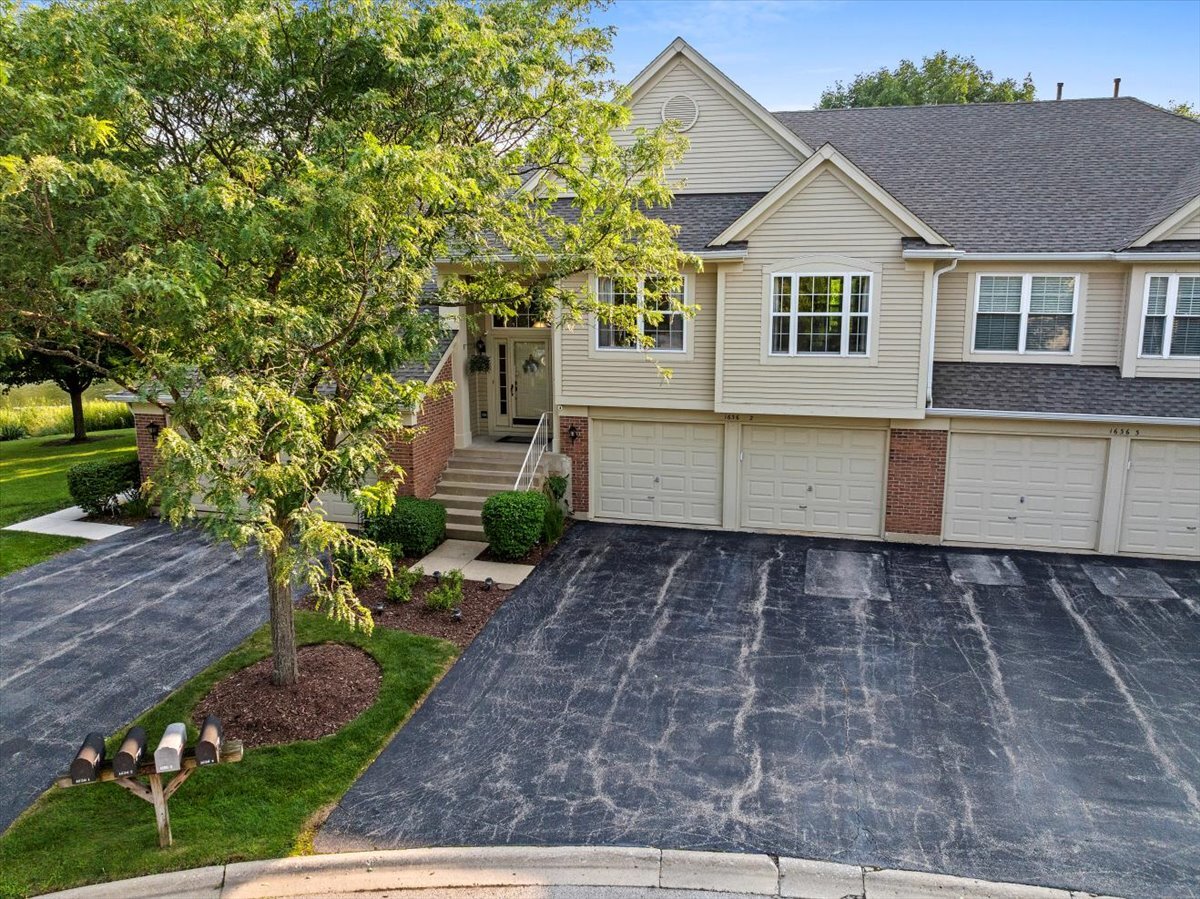 1636 Columbia Circle, Unit 2 Bartlett, IL 60103 - Photo 4 of 47 a view of a house with a yard