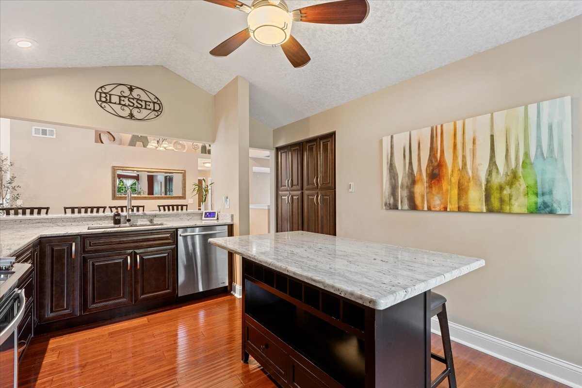 1636 Columbia Circle, Unit 2 Bartlett, IL 60103 - Photo 9 of 47 a kitchen with a stove and a microwave