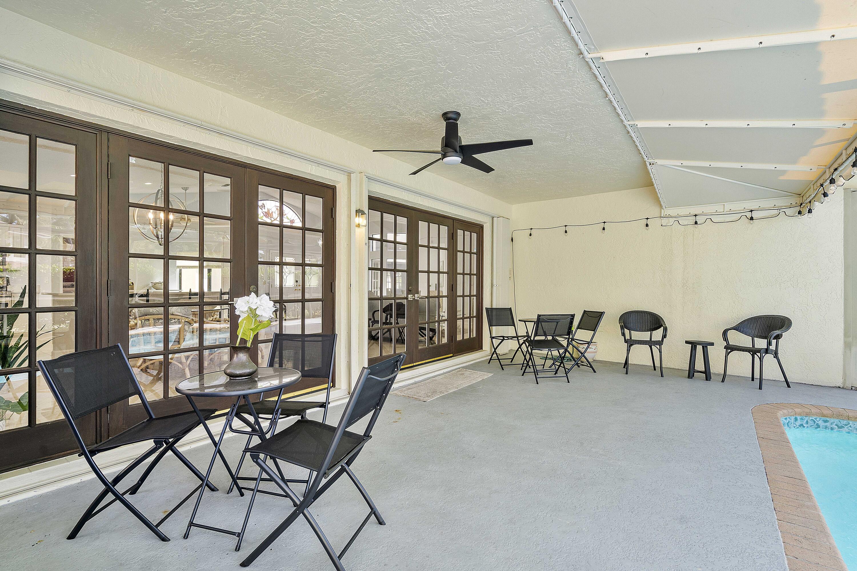 22652 Esplanada Circle Boca Raton, FL 33433 - Photo 16 of 44 a dining room with furniture and chandelier