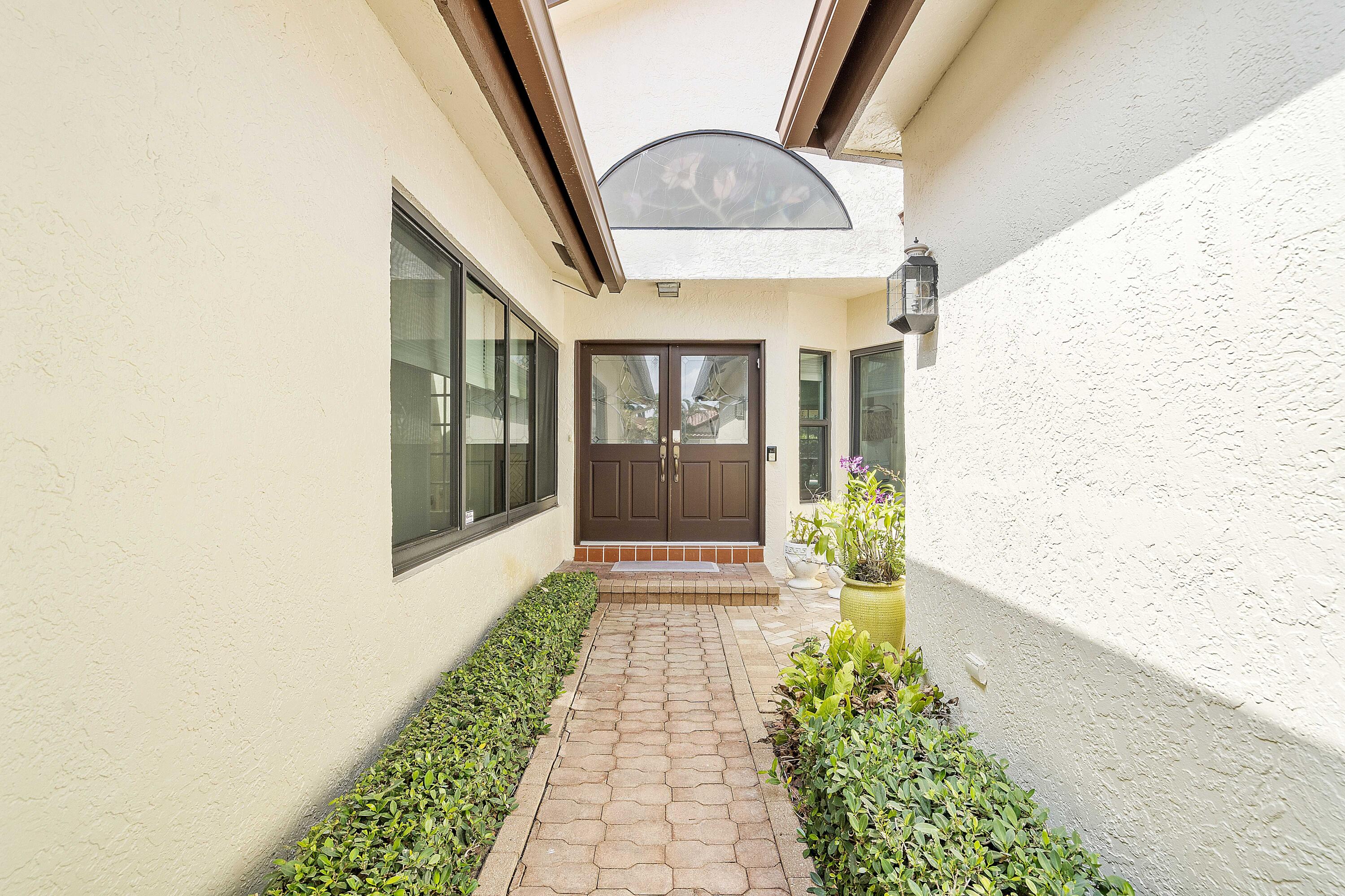 22652 Esplanada Circle Boca Raton, FL 33433 - Photo 24 of 44 a front view of a house with a porch