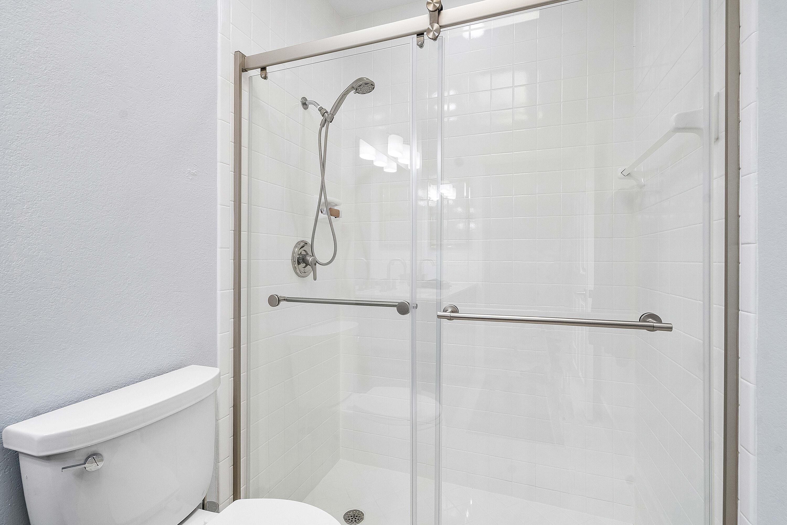 22652 Esplanada Circle Boca Raton, FL 33433 - Photo 28 of 44 a bathroom with a glass shower door