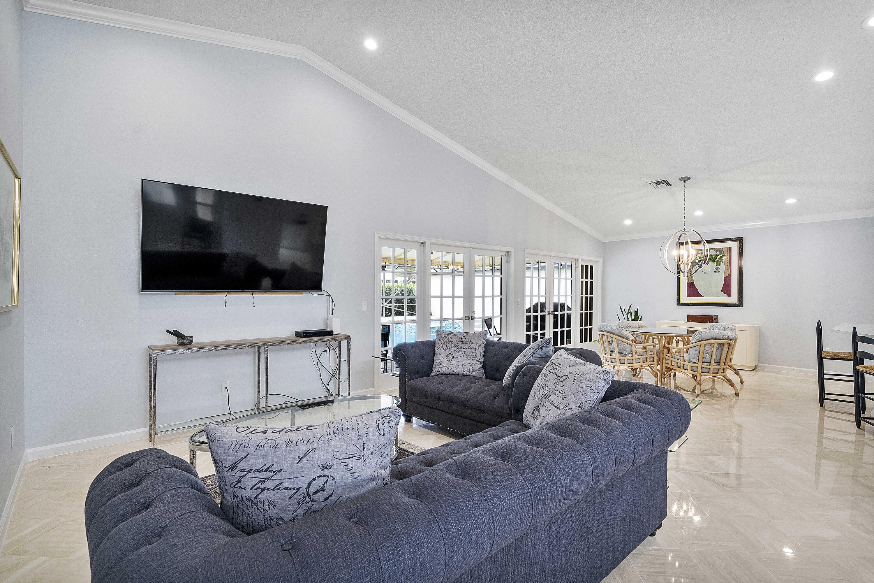 22652 Esplanada Circle Boca Raton, FL 33433 - Photo 30 of 44 a living room with furniture and a flat screen tv