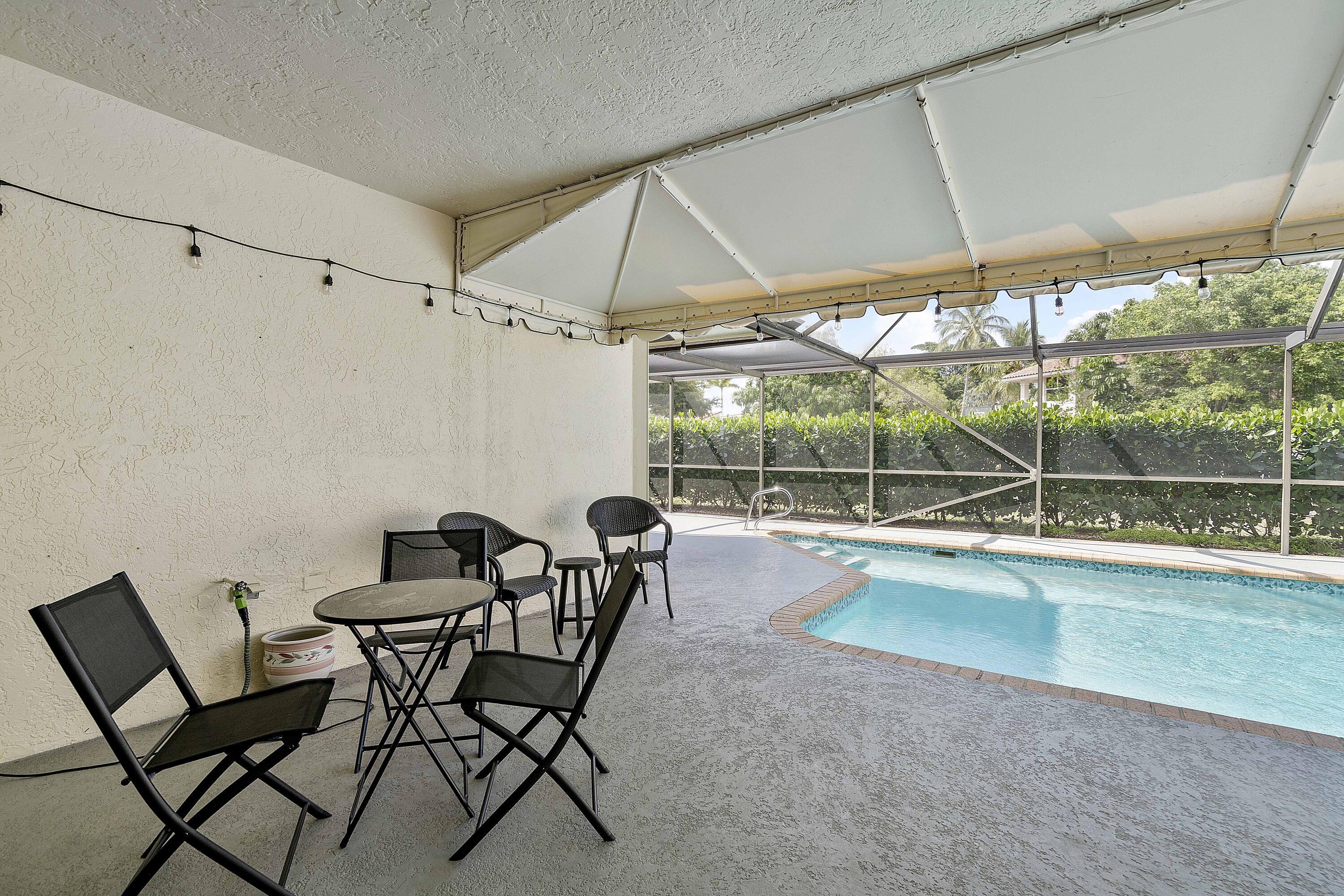 22652 Esplanada Circle Boca Raton, FL 33433 - Photo 38 of 44 a view of a work space with a table and chairs