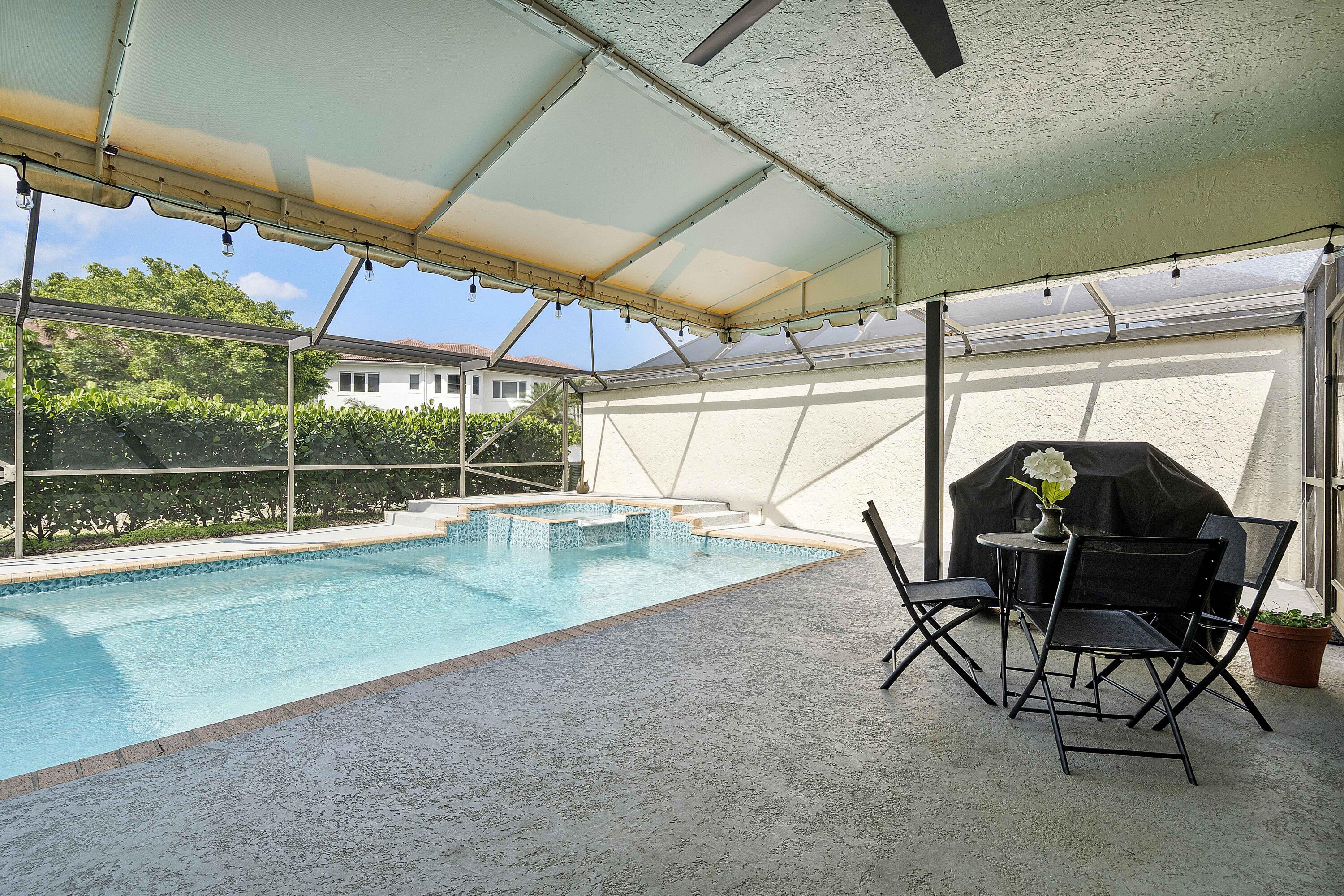 22652 Esplanada Circle Boca Raton, FL 33433 - Photo 39 of 44 a view of a swimming pool with a porch