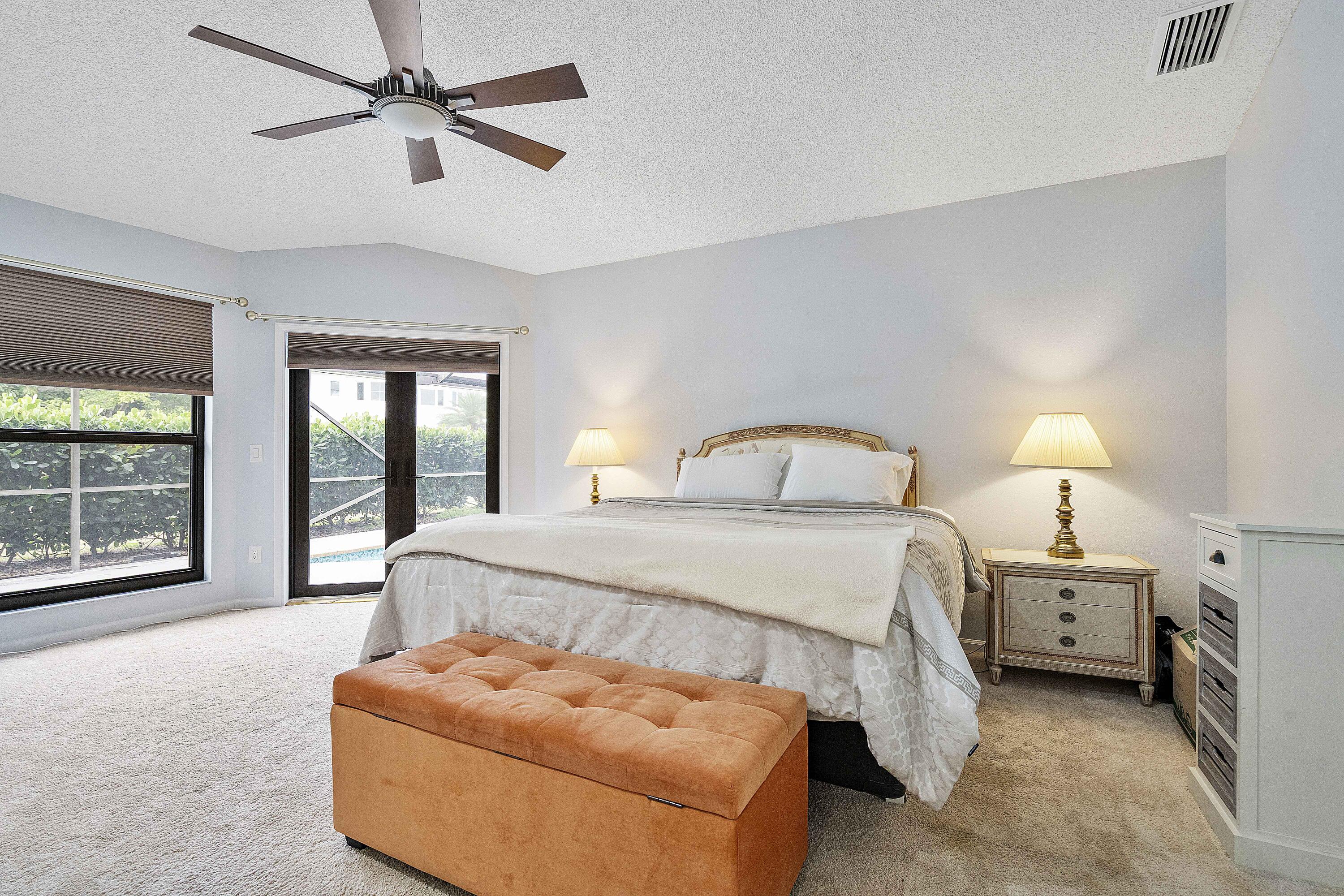 22652 Esplanada Circle Boca Raton, FL 33433 - Photo 10 of 44 a bedroom with bed window and couch