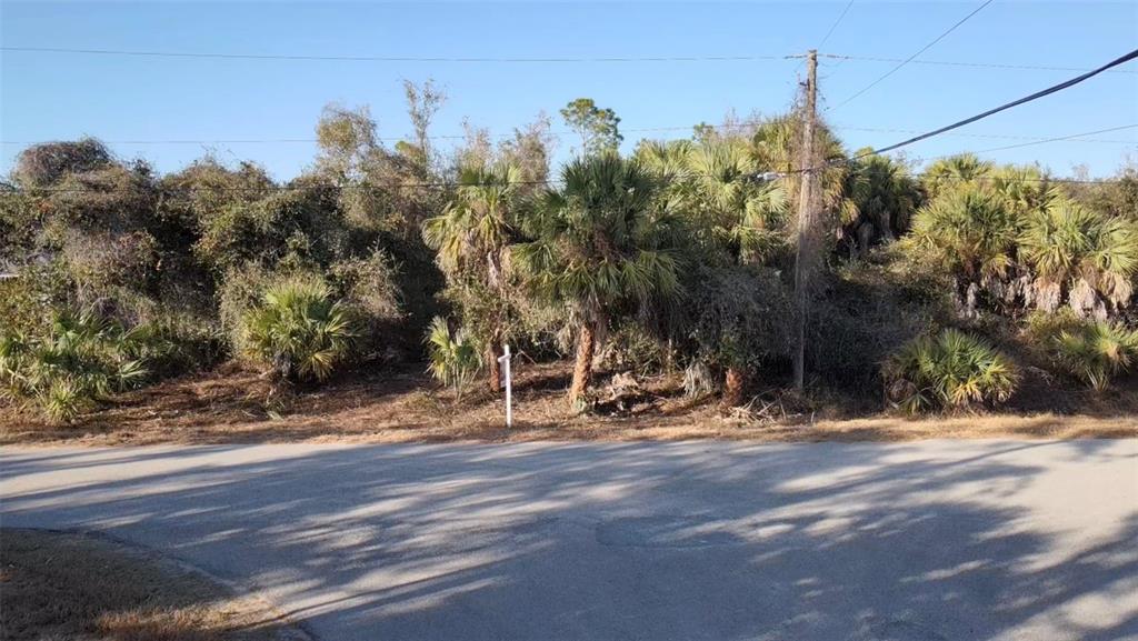 5 Countess Avenue North Port, FL 34288 - Photo 12 of 17 a view of a road with a building in the background