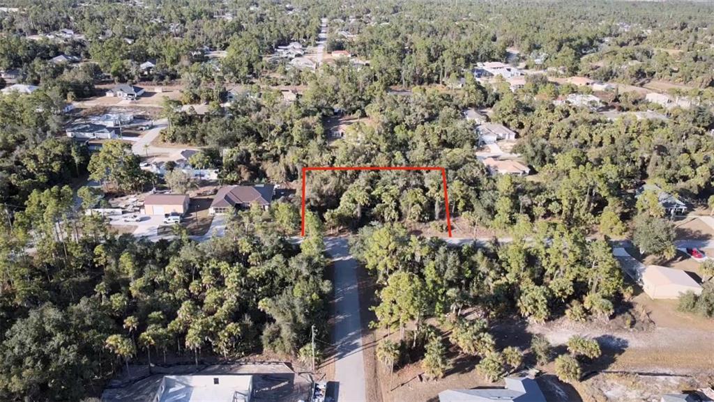 5 Countess Avenue North Port, FL 34288 - Photo 15 of 17 an aerial view of residential house with parking and trees