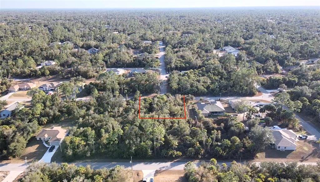 5 Countess Avenue North Port, FL 34288 - Photo 17 of 17 an aerial view of house with yard and mountain view in back