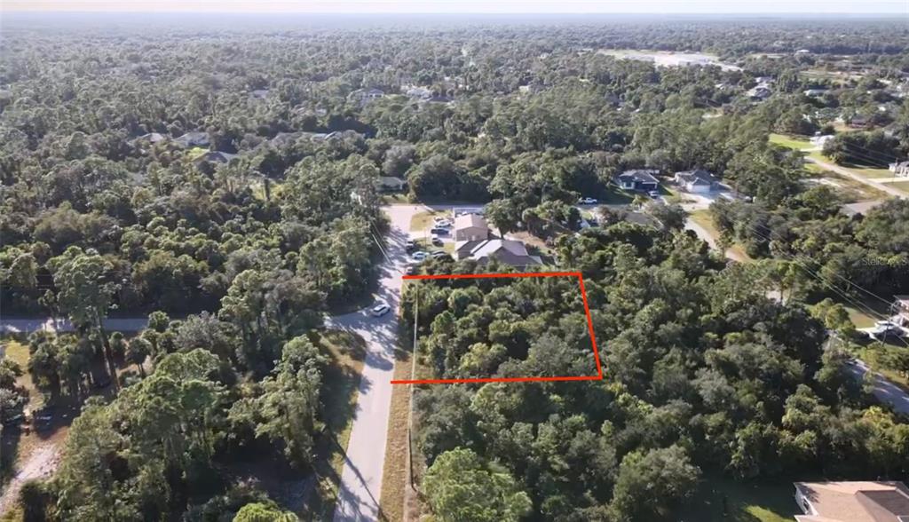 5 Countess Avenue North Port, FL 34288 - Photo 6 of 17 an aerial view of house with yard and mountain view in back