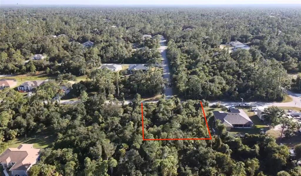 5 Countess Avenue North Port, FL 34288 - Photo 8 of 17 an aerial view of house with yard and mountain view in back