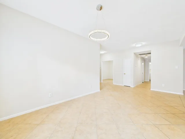 a view of an empty room with a fireplace