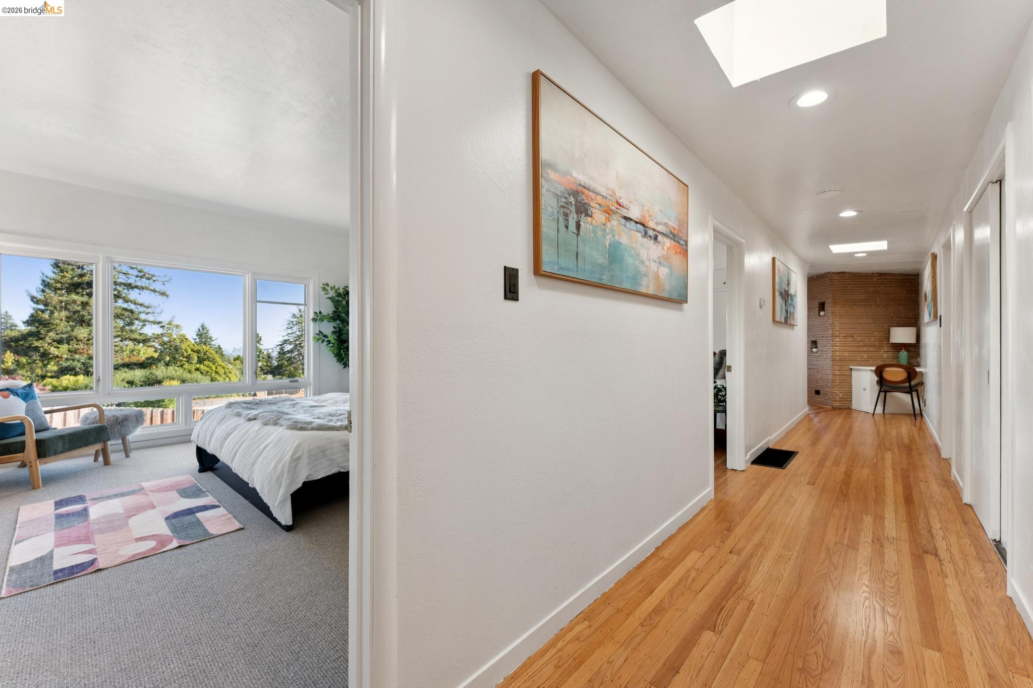 2301 Oak Street Berkeley, CA 94708 - Photo 10 of 61 Bright hallway featuring wood-finish flooring, recessed lighting, and skylights
