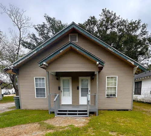 a front view of a house with yard