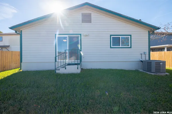 a view of a backyard of the house