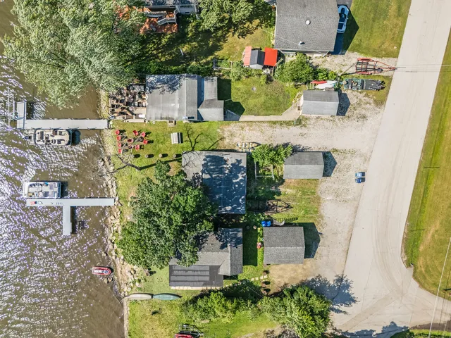 an aerial view of a house with a swimming pool