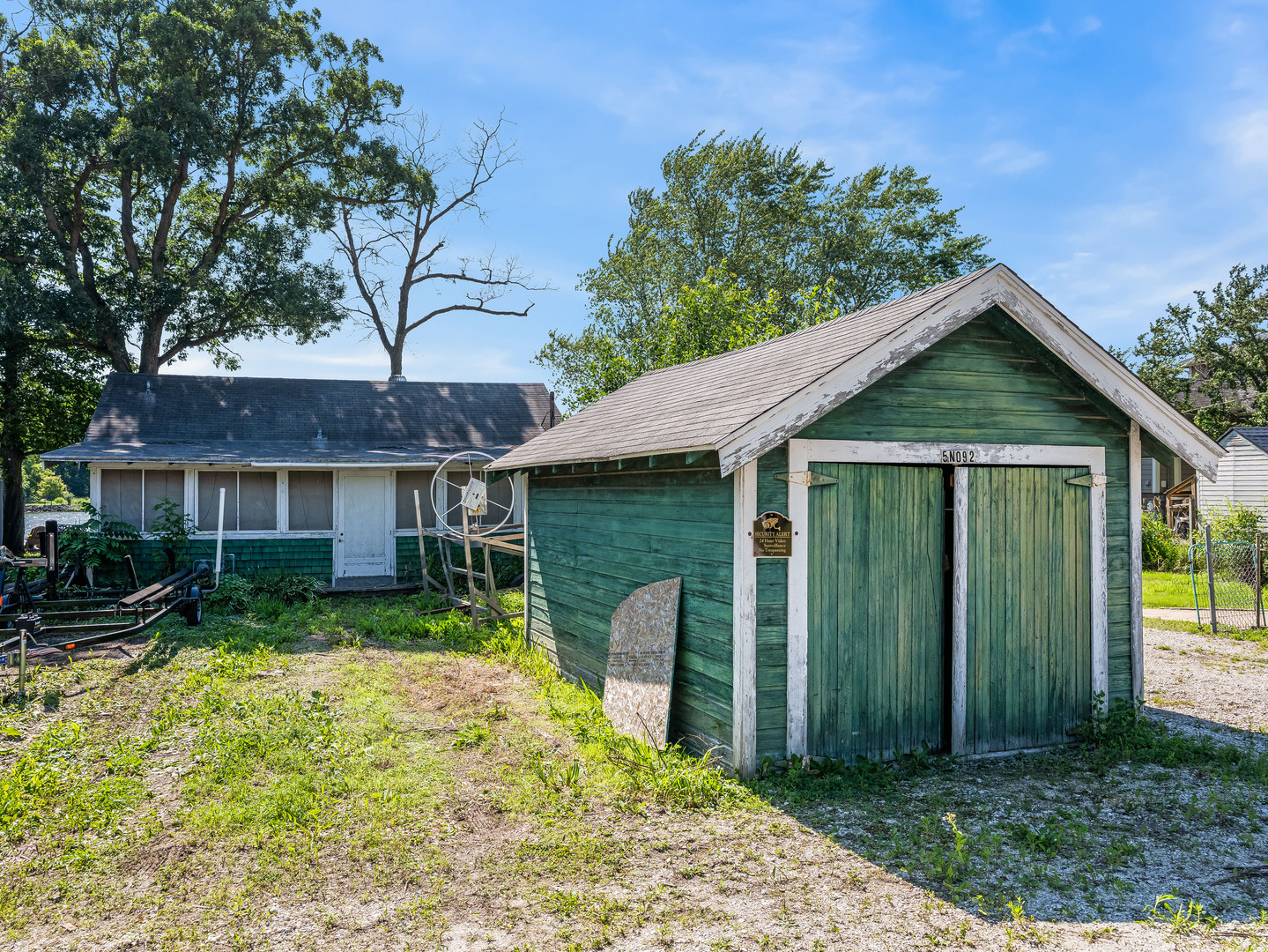 5-n092 Grove Avenue St. Charles, IL 60174 - Photo 9 of 20 a front view of a house with garden