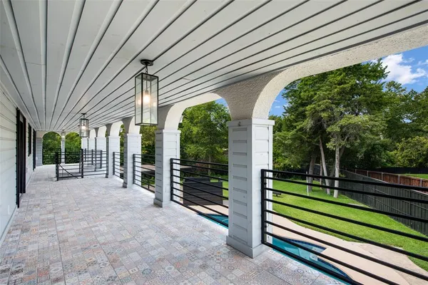 a view of a swimming pool with a balcony
