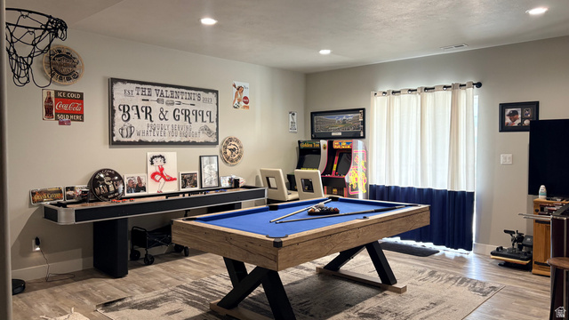 7889 Bristlecone Road Eagle Mountain, UT 84005 - Photo 29 of 42 Game room featuring a billiard table with wood-finish base, wood-finish flooring, recessed lighting, and wall-mounted arcade games