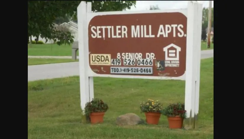 8 Senior Drive Greenwich, OH 44837 - Photo 5 of 7 a sign that is sitting on a brick wall