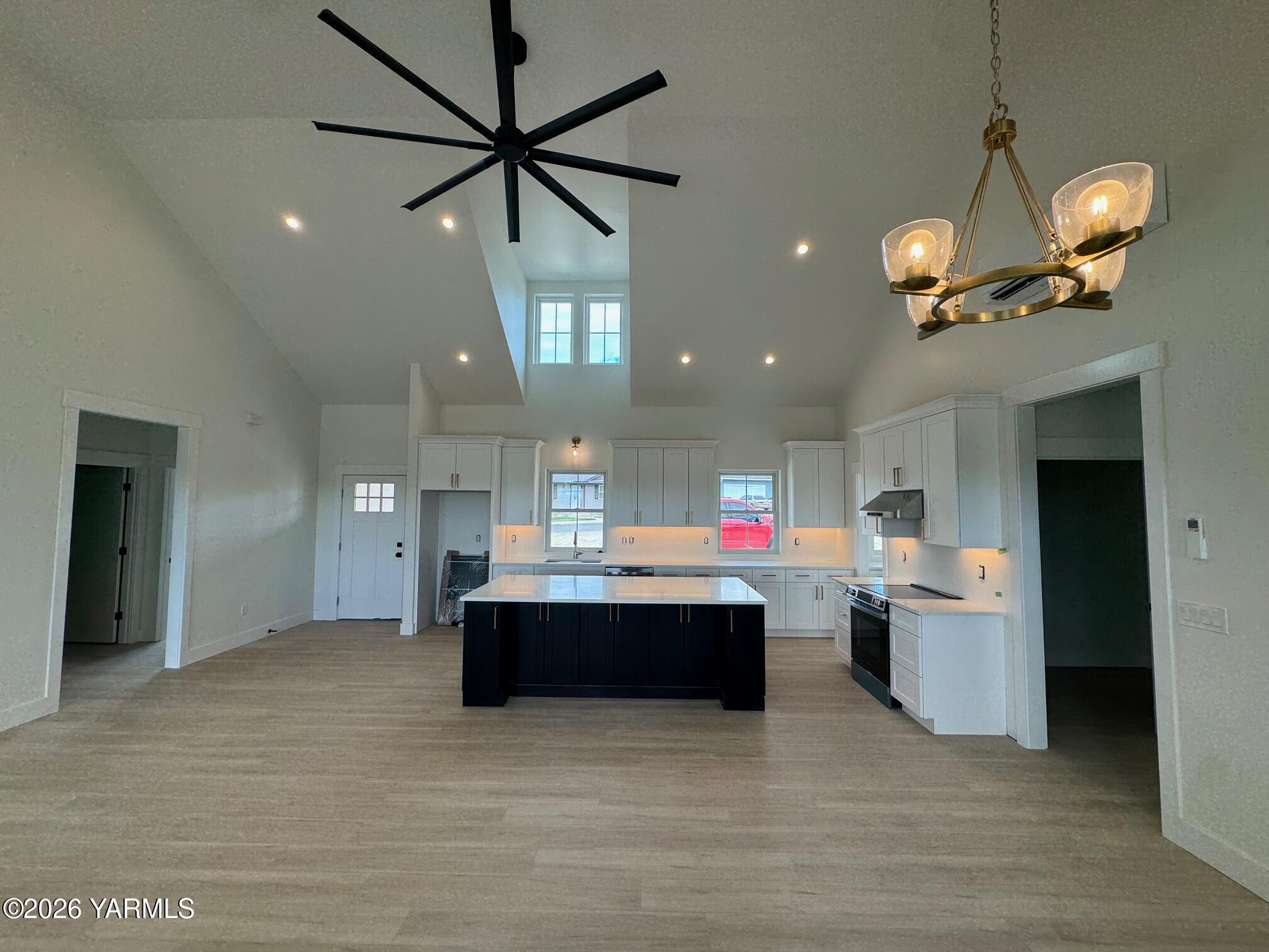 304 6th Street Zillah, WA 98953 - Photo 3 of 29 a kitchen view of a dining table chairs stainless steel appliances and a ceiling fan
