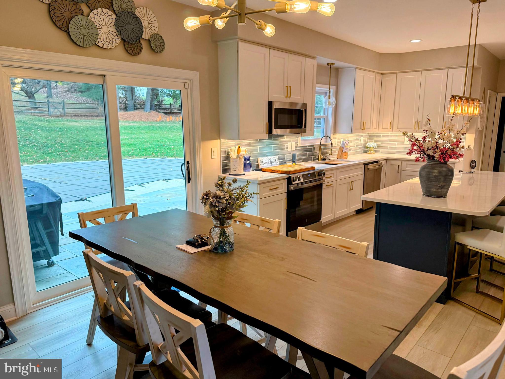 239 Heather Ridge Circle West Chester, PA 19382 - Photo 19 of 54 a kitchen with a table chairs stove and kitchen view