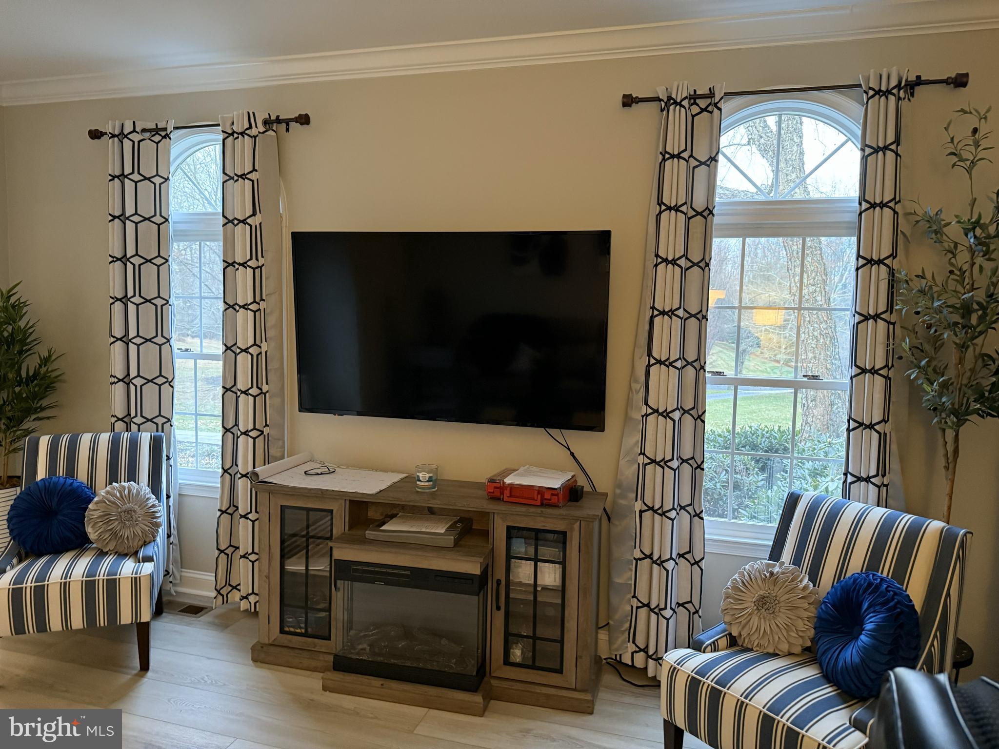 239 Heather Ridge Circle West Chester, PA 19382 - Photo 49 of 54 a living room with furniture a flat screen tv and floor to ceiling window
