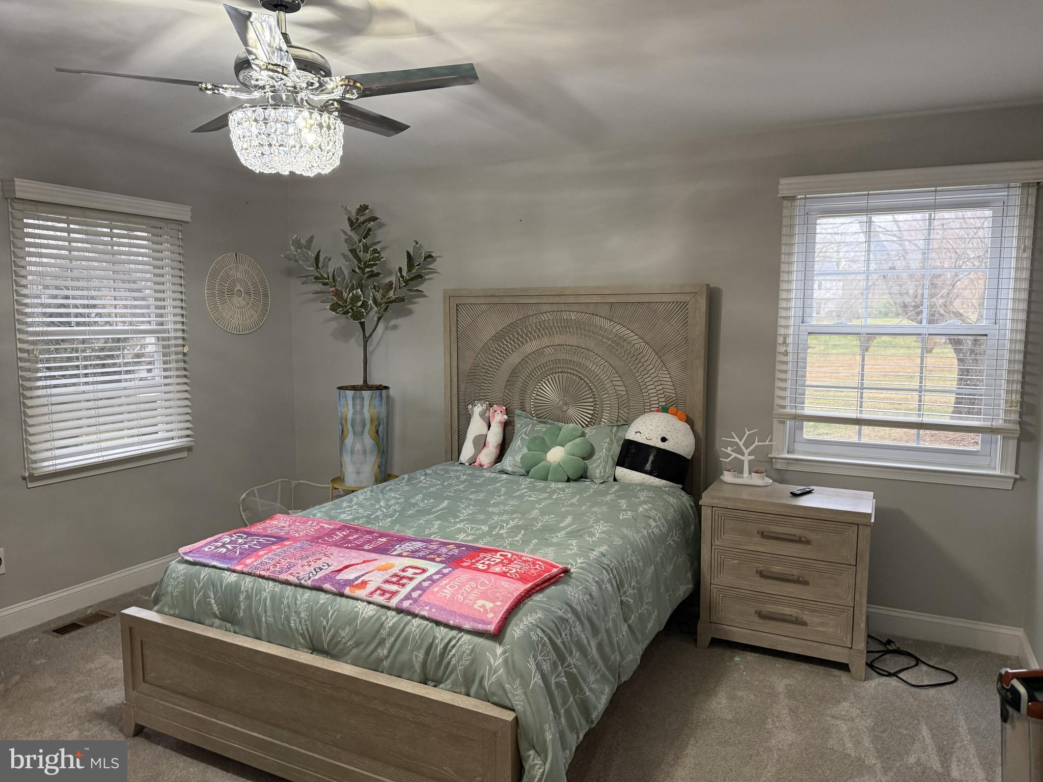 239 Heather Ridge Circle West Chester, PA 19382 - Photo 50 of 54 a bedroom with a bed a chandelier and a window