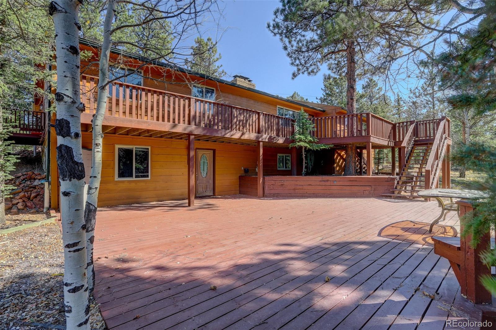 225 Spring Drive Pine, CO 80470 - Photo 11 of 44 a front view of a house