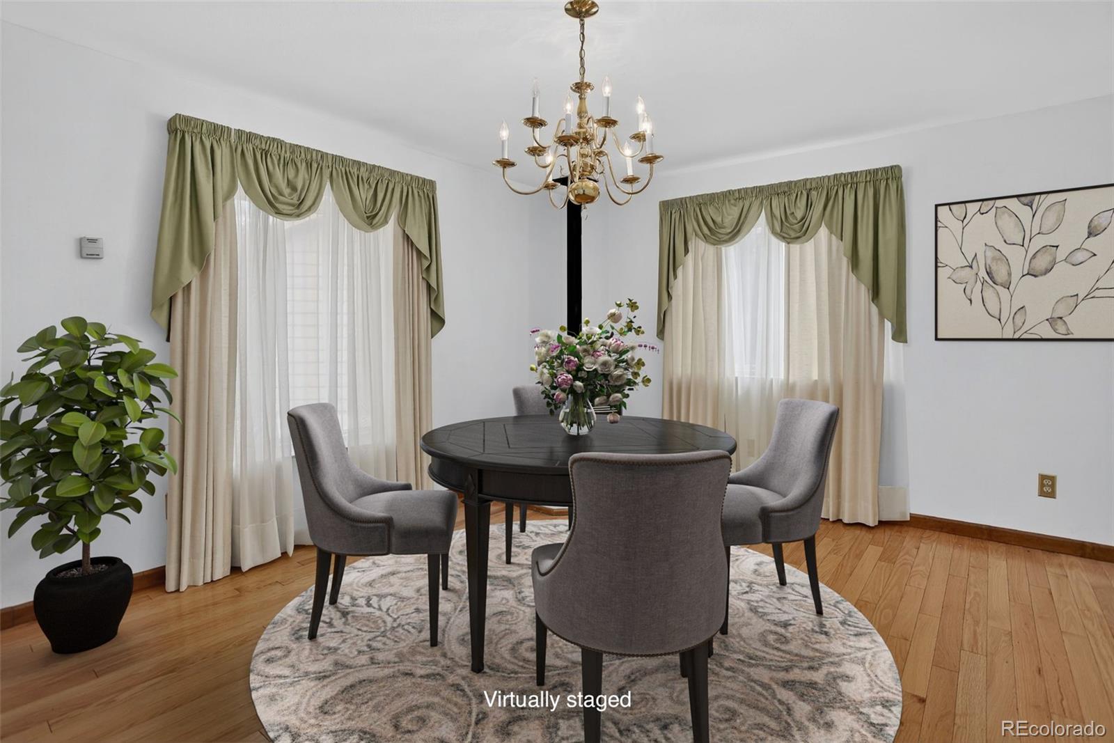 225 Spring Drive Pine, CO 80470 - Photo 16 of 44 a view of a dining room with furniture window and wooden floor