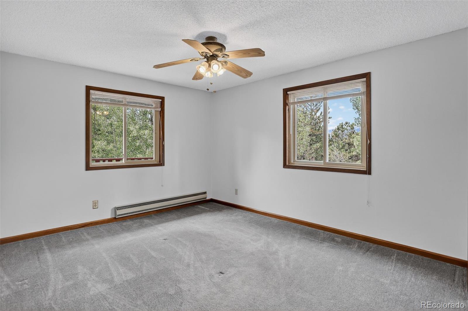 225 Spring Drive Pine, CO 80470 - Photo 30 of 44 a view of an empty room with a window