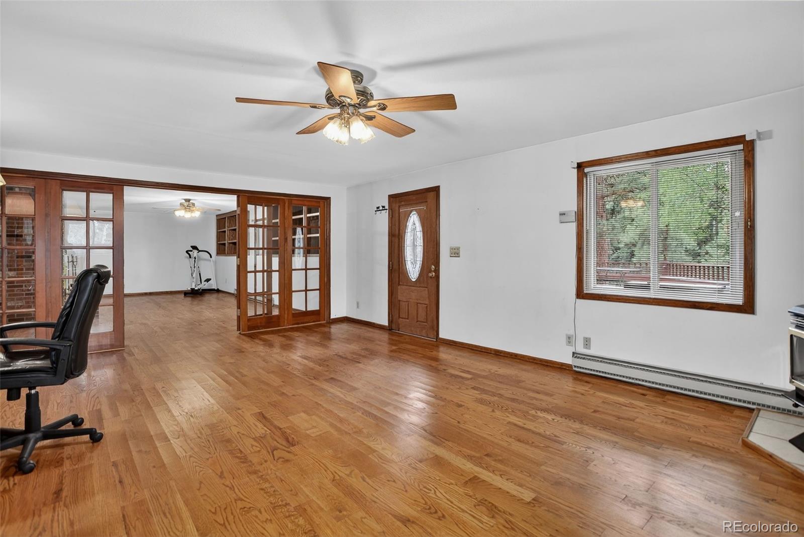 225 Spring Drive Pine, CO 80470 - Photo 34 of 44 a view of workspace with wooden floor and windows