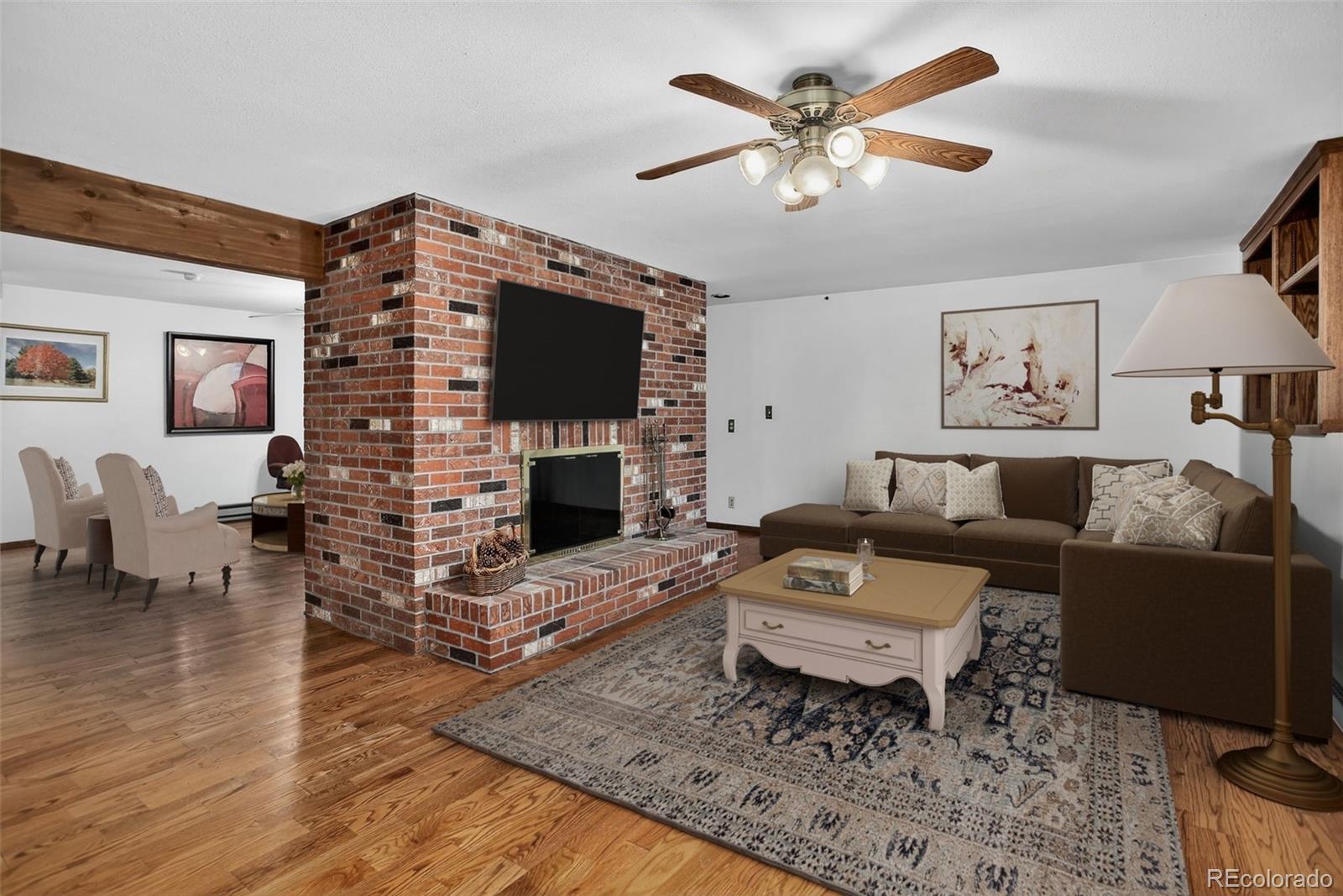 225 Spring Drive Pine, CO 80470 - Photo 36 of 44 a living room with furniture a flat screen tv and a fireplace