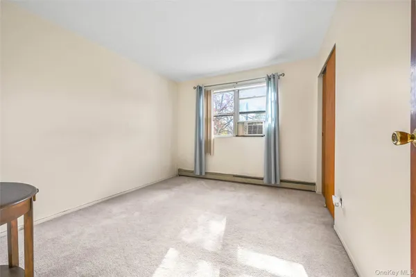 a view of an empty room and window