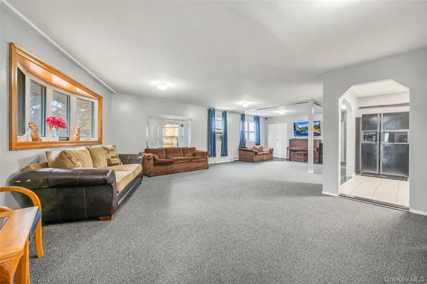 a living room with furniture and a gate