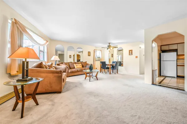 a view of a livingroom with furniture and a table