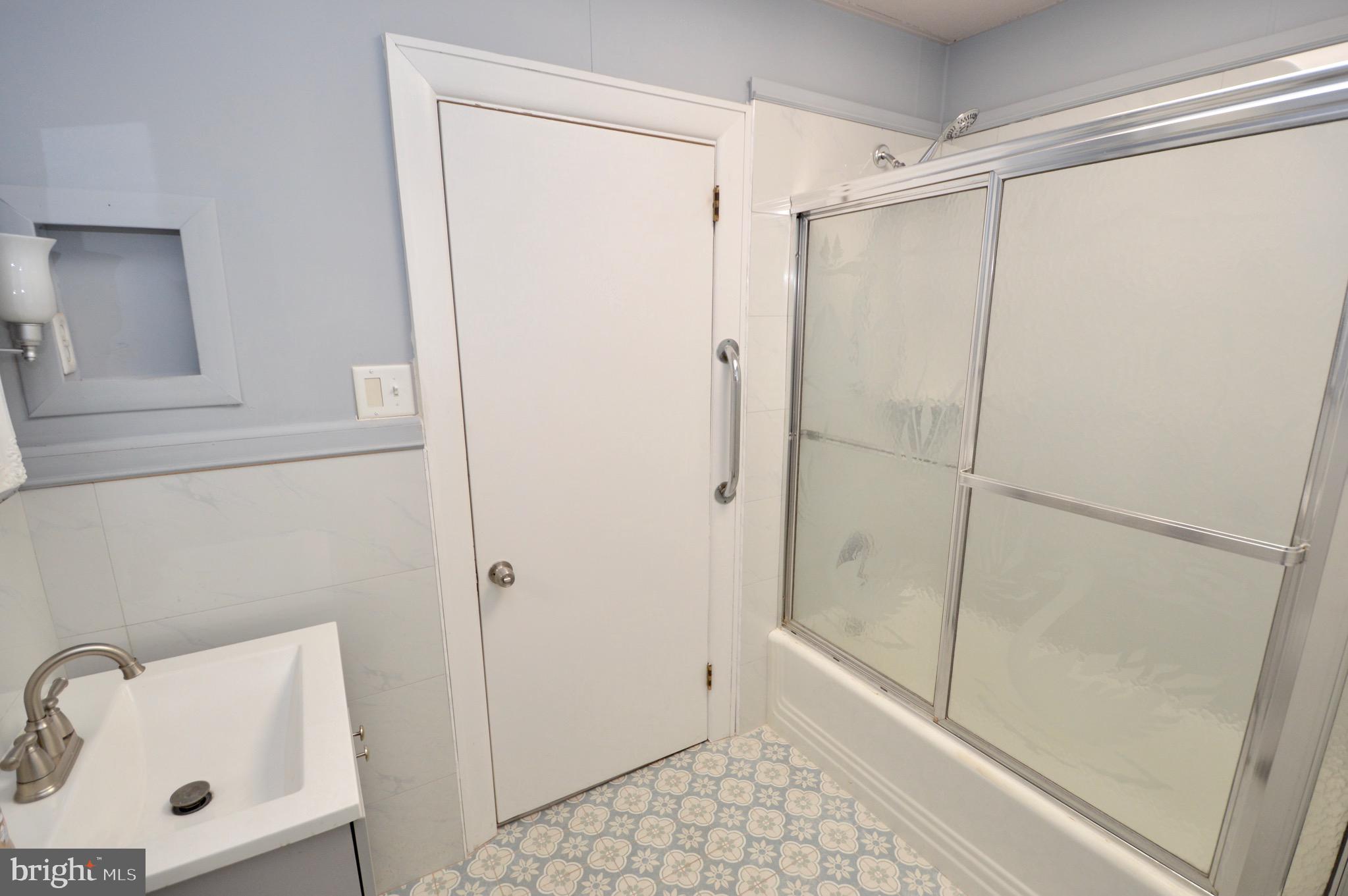 609 White Horse Pike Haddon Township, NJ 08107 - Photo 16 of 17 a bathroom with a shower and a sink