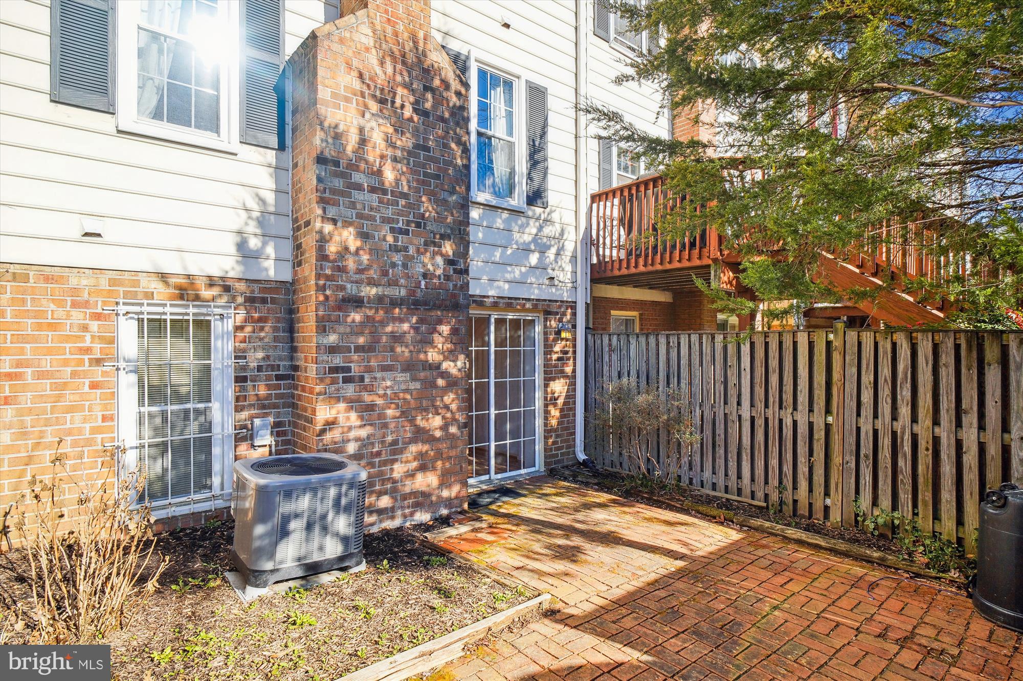 1046 Windrush Lane, Unit 38 Sandy Spring, MD 20860 - Photo 37 of 63 a backyard of a house with outdoor seating