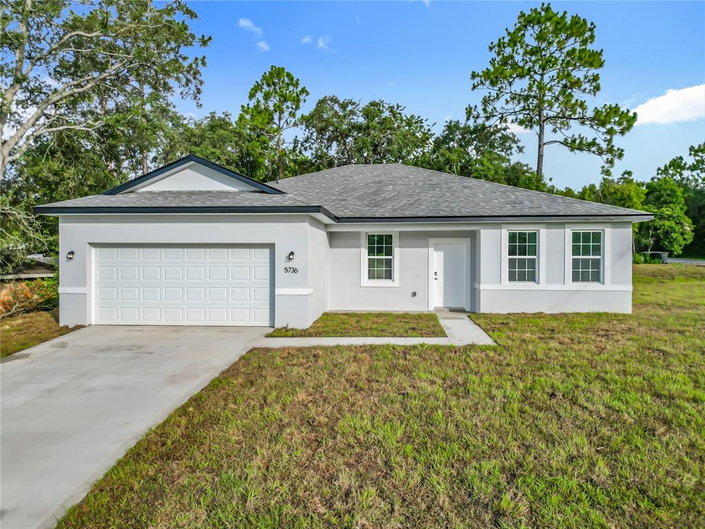 5736 North Claremont Drive Citrus Springs, FL 34434 - Photo 1 of 45 a house view with a garden space